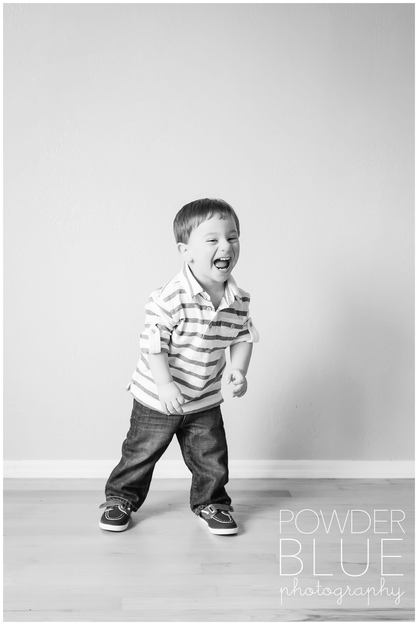 pittsburgh studio potrait natural light black and white one year old boy laughing