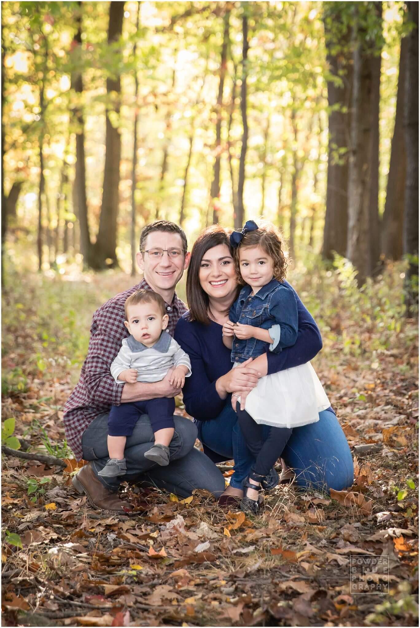 south hills pittsburgh family photographer. fall mini portrait sessions at fairview park in bridgeville, pa. family of four on fall colors with leaves and sunlight.